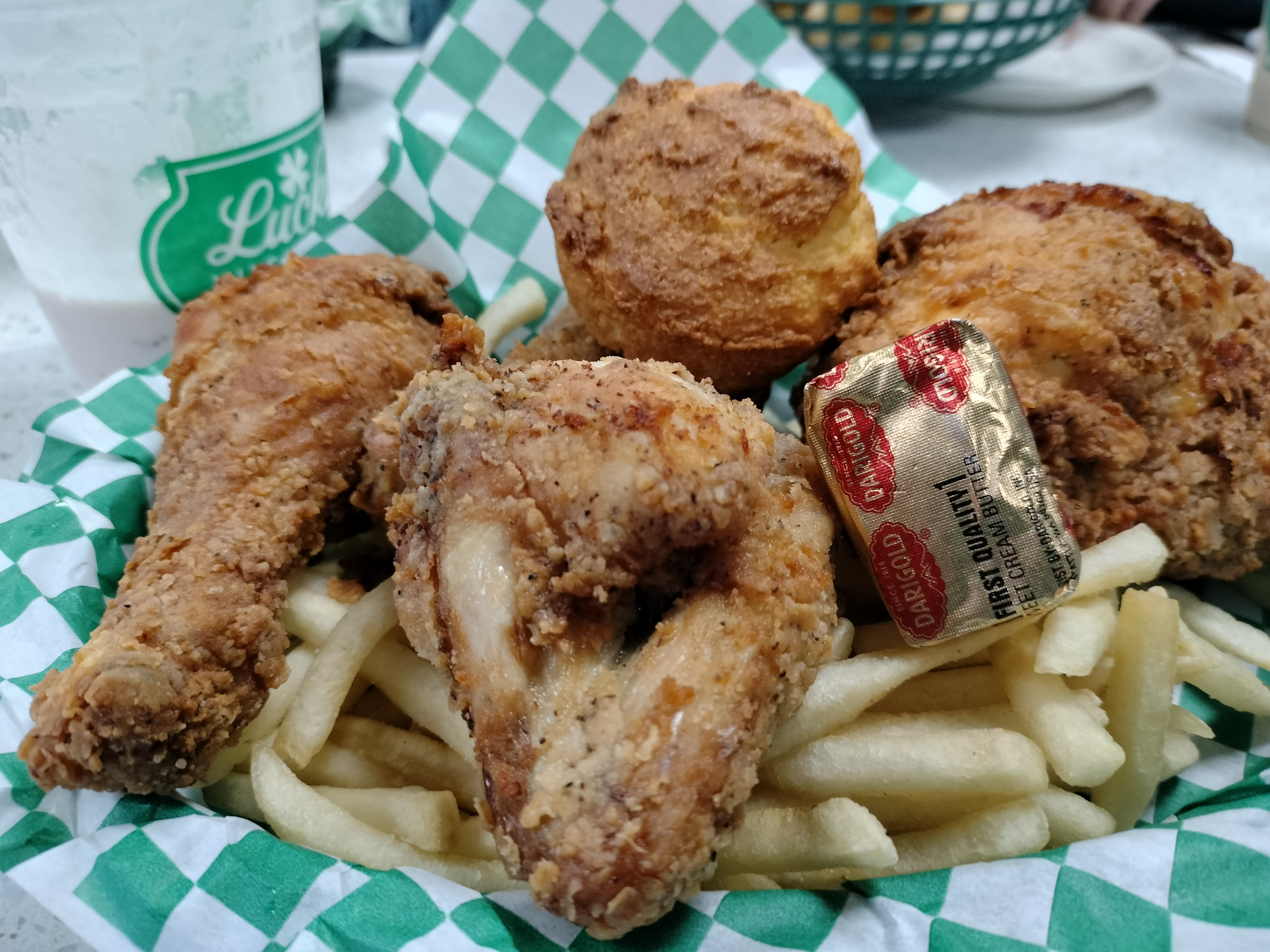 Pan fried chicken with fries and biscuit